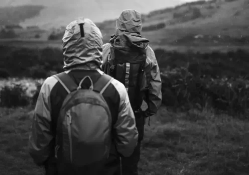 2 persons with backpacks hiking
