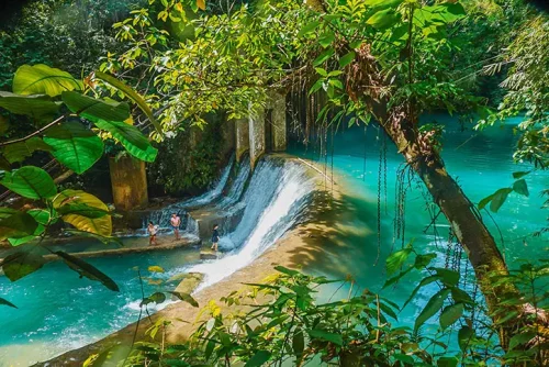 A picture of kids playing at Kawasan Falls, Philippines