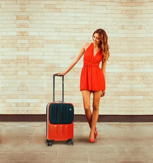 Woman in red dress near a Mia Toro Luggage